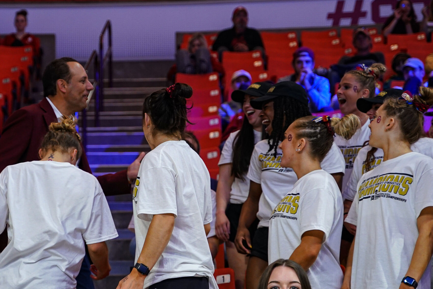 Joseph Harroz congratulates OU women's gymnastics